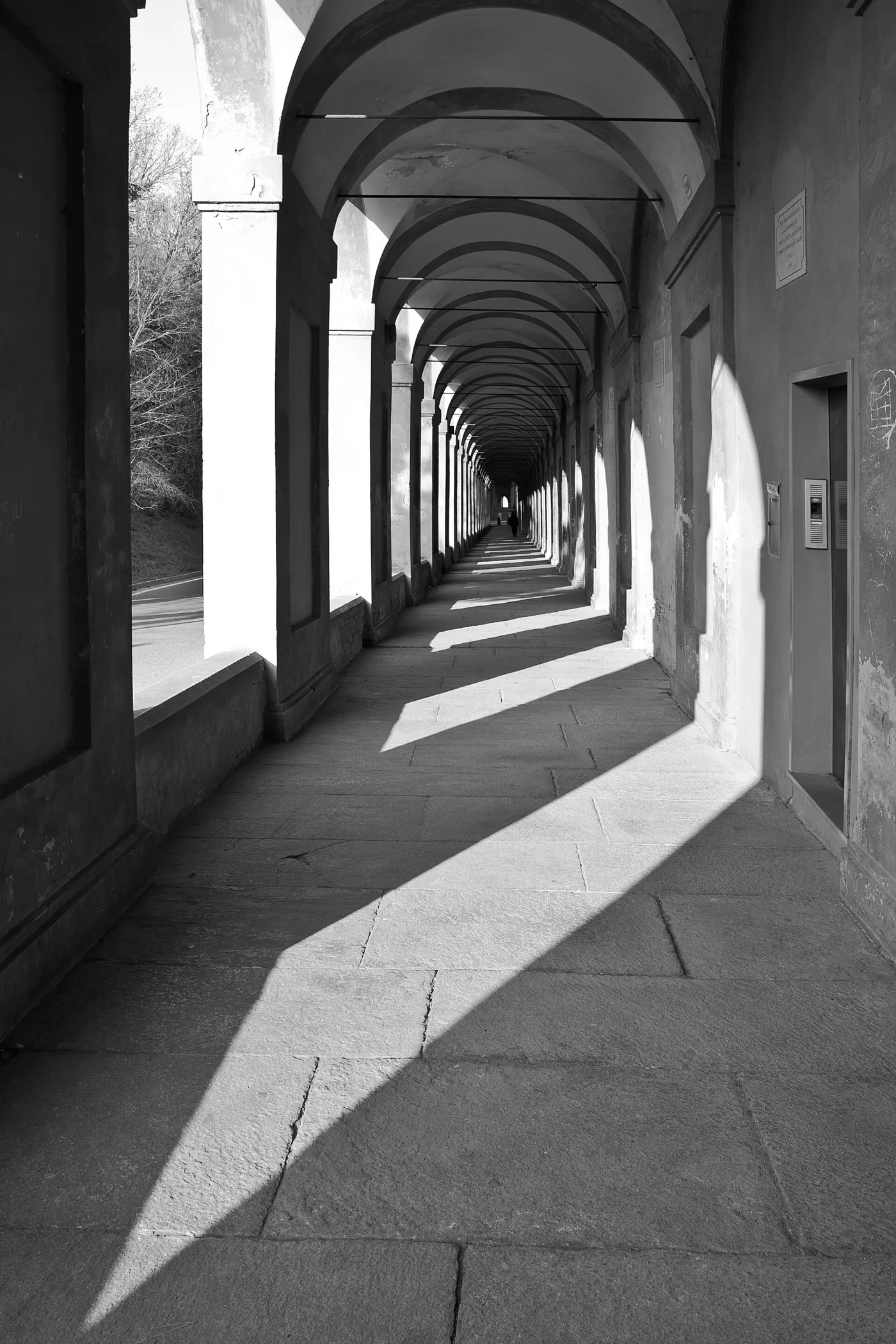 A stretch of the San Luca portico, with arches climbing towards the sanctuary